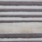 Soft off-white wave-patterned throw with grey accents, ideal for cozy chalet-inspired decor.