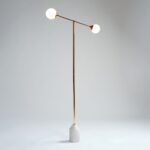 ALEXA gold metal floor lamp with two glass globes and a white marble base.
