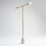 ALEXA gold metal floor lamp with two glass globes and a white marble base.