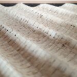 Square woven palm wall art in oak frame with light and dark brown tones, by Versmissen.