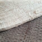 Square woven palm wall art in oak frame with light and dark brown tones, by Versmissen.