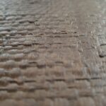 JULIE circular wall art with natural and dark brown woven palm in oak veneer frame by Versmissen.