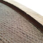 JULIE circular wall art with natural and dark brown woven palm in oak veneer frame by Versmissen.