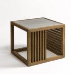 Natural oak side table with tempered glass top and slatted wood sides, designed for light-filled modern living spaces.