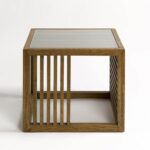 Natural oak side table with tempered glass top and slatted wood sides, designed for light-filled modern living spaces.