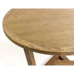 ELMA Oak Dining Table with round oak top and interlocking geometric base, featuring natural wood finish and spacious design for modern dining rooms.