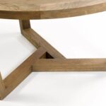 ELMA Oak Dining Table with round oak top and interlocking geometric base, featuring natural wood finish and spacious design for modern dining rooms.