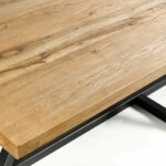 DIAGO oak dining table with textured oak top and black central metal base.