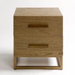 MONICA oak bedside table with two drawers and aged gold metal base and handles.