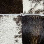 TAURUS Cowhide Pouf – Luxurious brown and white cowhide pouf, perfect as an accent piece, footrest, or extra seating.