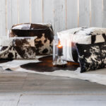 TAURUS Cowhide Pouf – Luxurious brown and white cowhide pouf, perfect as an accent piece, footrest, or extra seating.