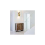 Natural wood small sideboard with slatted palillería doors and glass panels, standing on modern wooden legs.