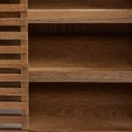 Natural wood small sideboard with slatted palillería doors and glass panels, standing on modern wooden legs.