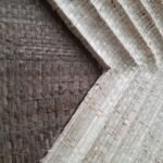 Square woven palm wall art in oak frame with light and dark brown tones, by Versmissen.