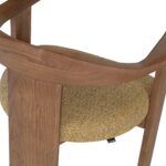 Contemporary armchair with a walnut-finished wood frame and Havana-coloured cushion in VEROTEX fabric, designed for modern, eco-conscious interiors.