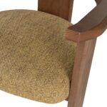 Contemporary armchair with a walnut-finished wood frame and Havana-coloured cushion in VEROTEX fabric, designed for modern, eco-conscious interiors.