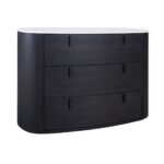 Black-brown oak oval chest of drawers with white stone top and three drawers with metal handles.