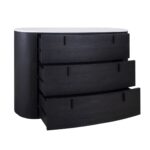 Black-brown oak oval chest of drawers with white stone top and three drawers with metal handles.