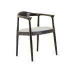 Grey leather chair with black teak frame, open back design, and metallic stud detailing—blending elegance with everyday comfort.