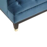 Three-seat navy Chesterfield-style fabric sofa with button tufting and gold-accented wooden legs.