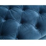 Three-seat navy Chesterfield-style fabric sofa with button tufting and gold-accented wooden legs.