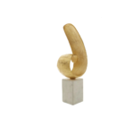 Gold finish curl sculpture on white marble base – modern decorative accent.