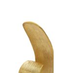 Gold finish curl sculpture on white marble base – modern decorative accent.