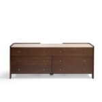 Dark brown oak chest of drawers with six drawers, white stone top, and elegant side profiles—designed for luxury interiors and refined storage.