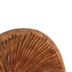 Large carved mango wood disc on a black iron base with textured concave surface.