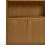 Tall natural oak display cabinet with rounded top, open shelving, and two-door lower storage.