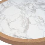 Round coffee table with light oak base and textured ceramic top, combining natural warmth with elegant simplicity.