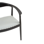 Grey leather chair with black teak frame, open back design, and metallic stud detailing—blending elegance with everyday comfort.