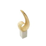 Gold finish curl sculpture on white marble base – modern decorative accent.