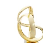 Gold knot sculpture on white marble base – elegant contemporary décor accent.