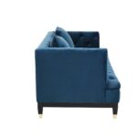 Two-seat navy fabric Chesterfield-style sofa with button tufting and gold-accented wooden legs.