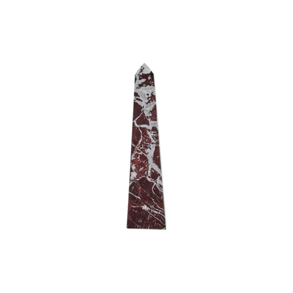 Large red marble obelisk with white veining on a minimalist geometric form.
