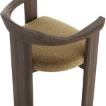 Contemporary armchair with a walnut-finished wood frame and Havana-coloured cushion in VEROTEX fabric, designed for modern, eco-conscious interiors.