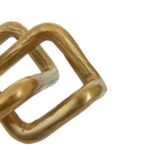 Gold distressed interlinked loop sculpture with modern minimalist design.