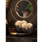 Black and gold aluminium boat dish with dimpled texture – modern sculptural table decor.
