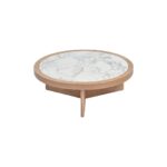 Round coffee table with light oak base and textured ceramic top, combining natural warmth with elegant simplicity.