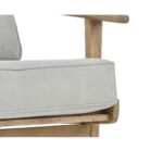 Oak armchair with grey linen cushions, slatted back, and mid-century modern design featuring pointed legs and straight arms.