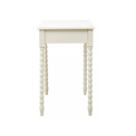 Ivory pine desk with spindle legs and two drawers with metallic knob handles.
