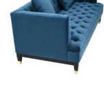 Two-seat navy fabric Chesterfield-style sofa with button tufting and gold-accented wooden legs.