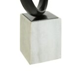 Contemporary knot sculpture in black nickel on a white marble base.