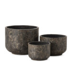 Medium black fibre cement planter with burnt finish and weathered texture, ideal for modern rustic décor indoors or out.