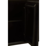 Modern black carved wood sideboard with abstract pattern and slim black metal legs, featuring ample concealed storage.