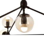 Matte black 10-arm pendant light with tinted brown glass globes in a geometric prismatic layout, ideal for industrial and mid-century interiors.
