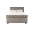 Romir king-size bed with grey velvet upholstery, rolled headboard and footboard, button tufting, and lift-up ottoman storage.