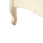 White carved wooden bed with upholstered buttoned panels, featuring a rustic weathered finish and bohemian French-inspired design.