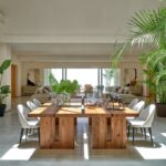 Large oakwood and black metal dining table with industrial design, handcrafted from natural wood with a sleek iron base.